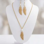 Conjunto Folha com Pérola do Rio dourado